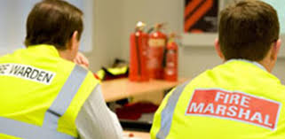 Shining Services fire wardens in hi-vis with fire extinguishers